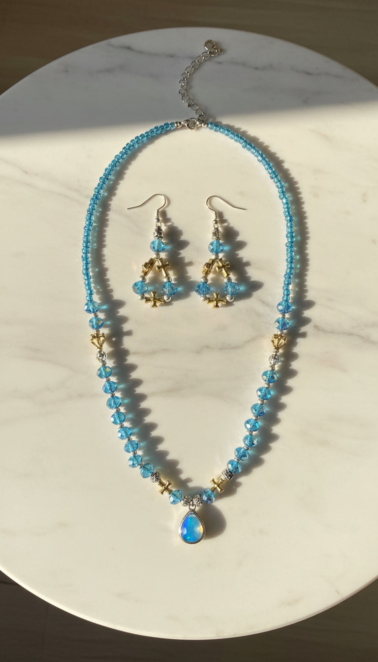 Necklace and earrings set on a marble table 